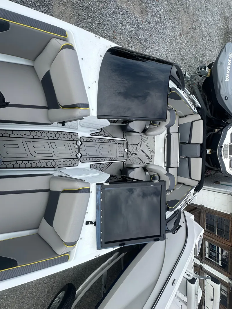 Slide: The Image of 2020 Scarab 195 ID boat interior with seating and dashboard. - 12