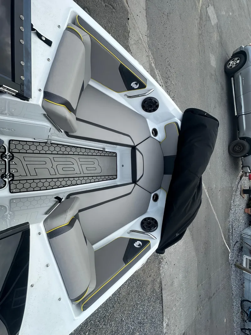 Slide: The Image of 2020 Scarab 195 ID boat interior with gray seating and black accents. - 13