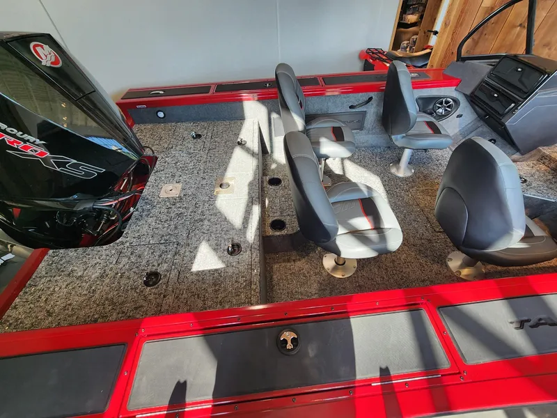 Slide: The Image of 2025 Tracker Targa V-18 WT boat interior with seating and Mercury engine. - 3
