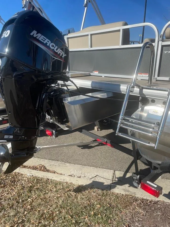 Slide: The Image of 2025 Sun Tracker Party Barge 16 DLX with Mercury outboard motor and ladder. - 3