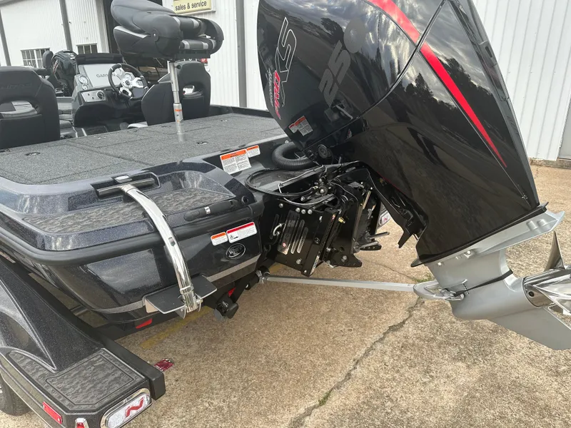 Slide: The Image of 2025 Nitro Z21 XL Pro boat with powerful outboard motor on trailer. - 10