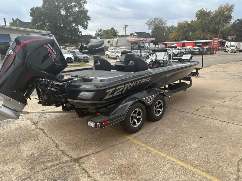 Slide: The Image of 2025 Nitro Z21 XL Pro boat on trailer, parked outdoors. - 3