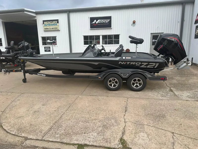 Slide: The Image of 2025 Nitro Z21 XL Pro boat on trailer outside dealership. - 4