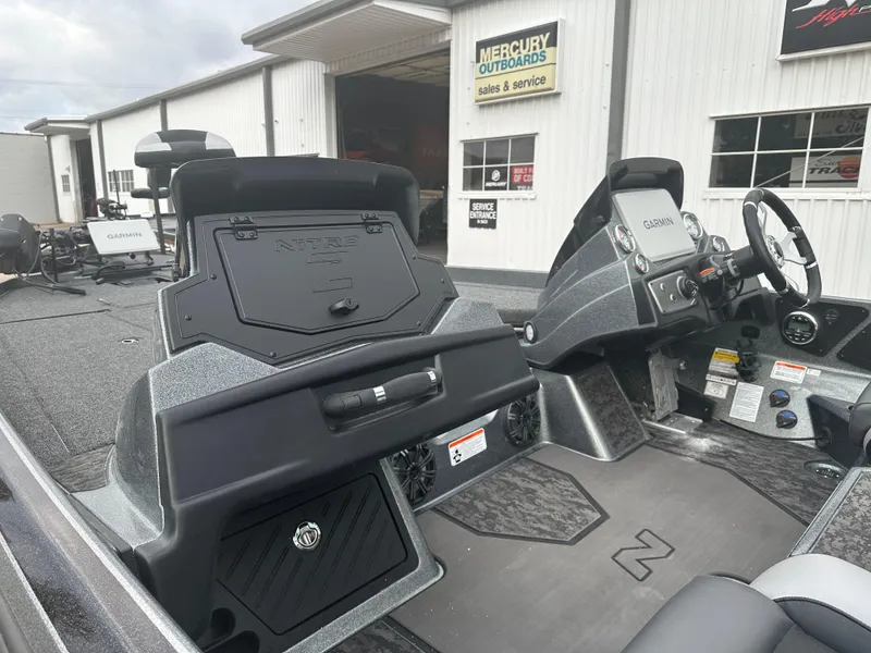 Slide: The Image of 2025 Nitro Z21 XL Pro boat interior at Mercury Outboards dealership. - 7