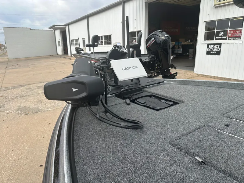 Slide: The Image of 2025 Nitro Z21 XL Pro boat with Garmin equipment at a service center. - 8