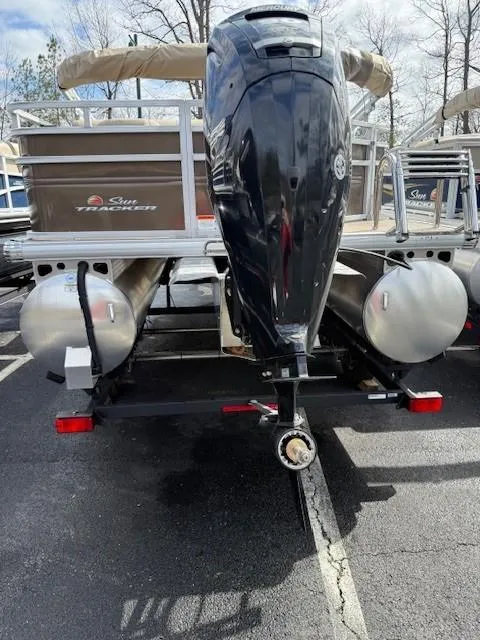 Slide: The Image of 2025 Sun Tracker SportFish 20 DLX pontoon boat with powerful outboard motor. - 2
