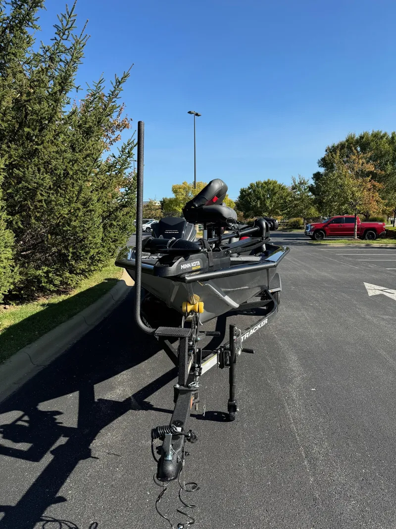 Slide: The Image of 2025 Tracker Pro Team 175 boat on trailer in parking lot. - 2