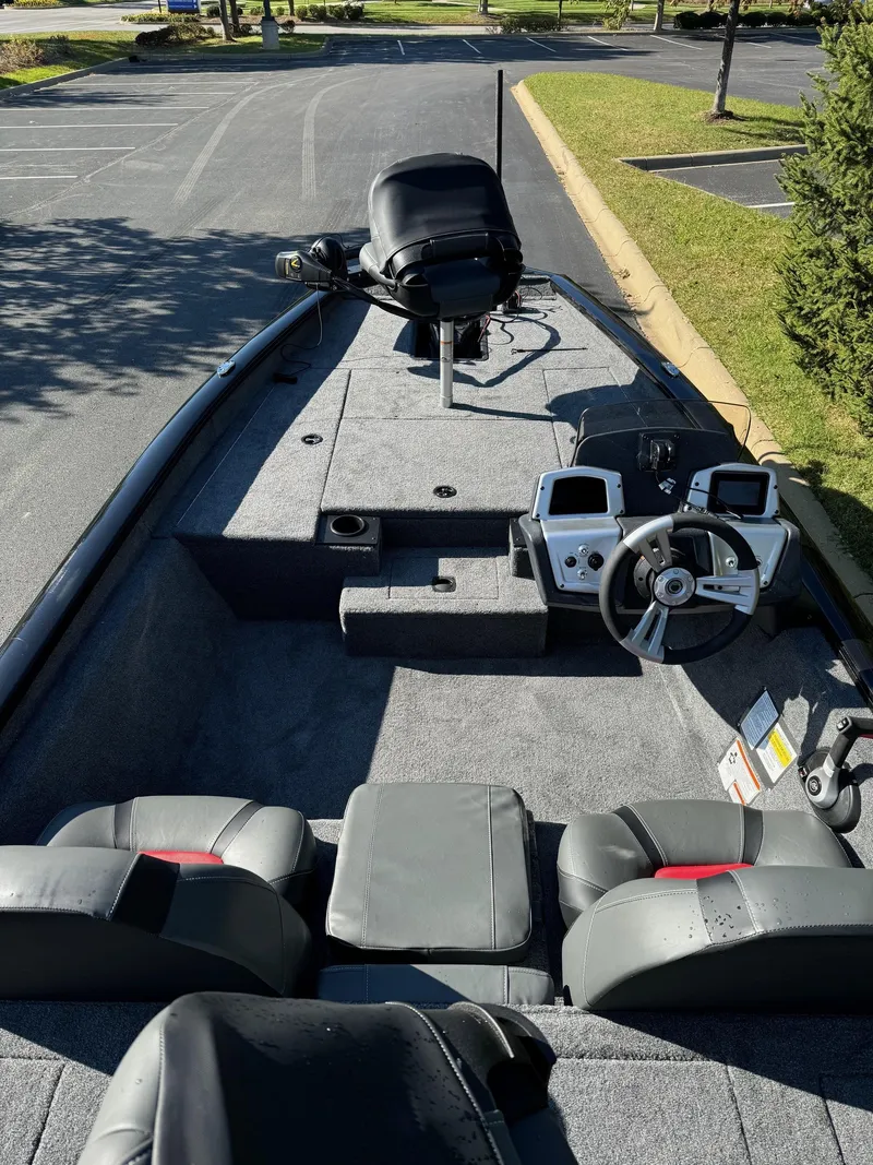 Slide: The Image of 2025 Tracker Pro Team 175 boat interior with steering console and seating. - 3