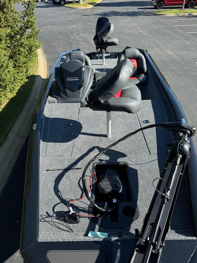 Slide: The Image of 2025 Tracker Pro Team 175 fishing boat with seating and equipment on deck. - 4
