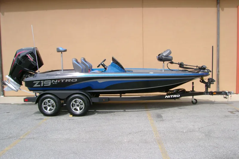 Slide: The Image of 2025 Nitro Z19 boat on trailer, featuring sleek design and powerful engine. - 5