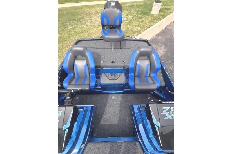 Slide: The Image of 2025 Nitro Z19 boat interior with blue and gray seating, featuring a spacious deck. - 11