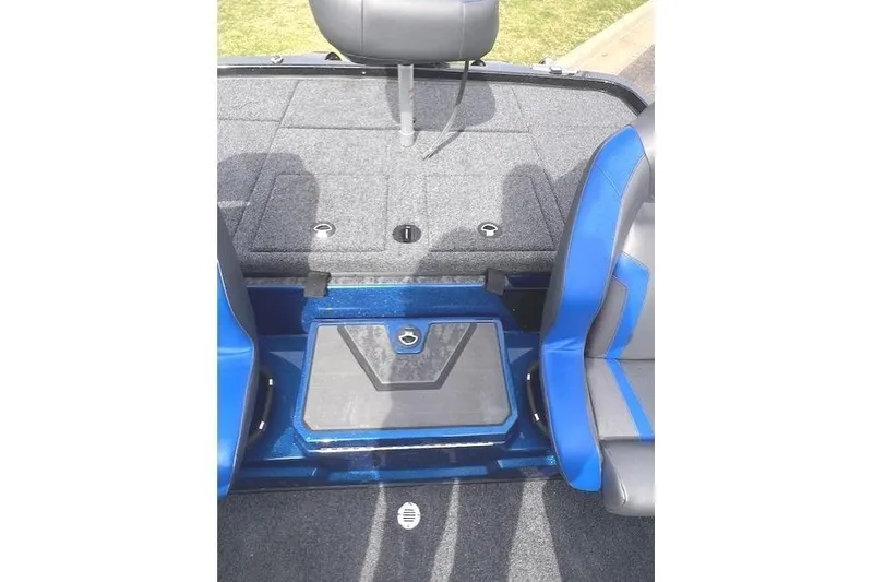 Slide: The Image of 2025 Nitro Z19 boat interior with blue and gray seating and storage compartments. - 13