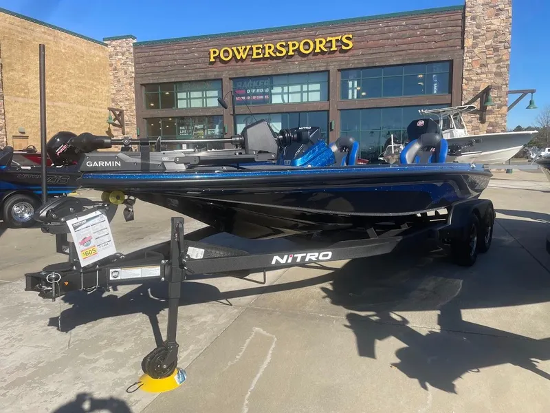 Slide: The Image of 2025 Nitro Z20 XL boat displayed outside Powersports store. - 0