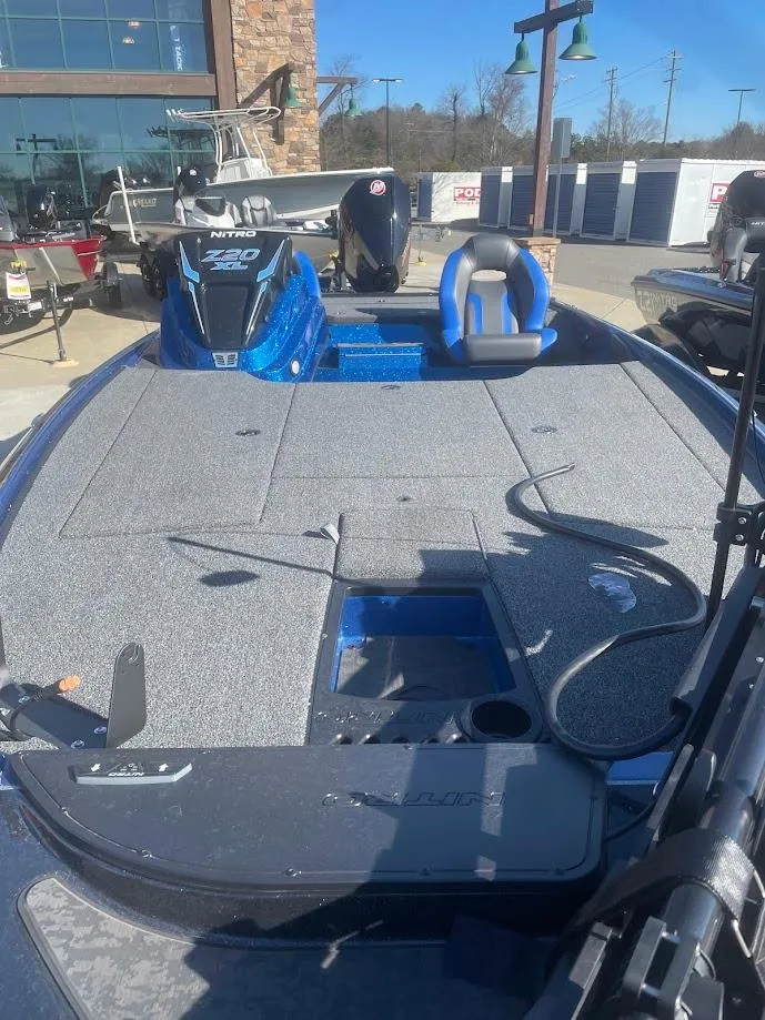 Slide: The Image of 2025 Nitro Z20 XL boat with spacious deck and seating, displayed outdoors. - 2