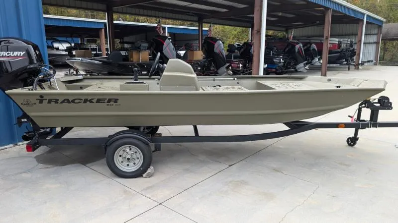 The Image of 2025 Tracker Grizzly 1648 SC boat on trailer in outdoor storage area. - 0