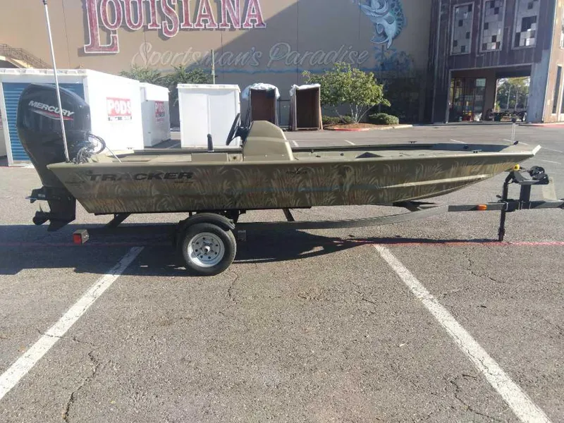 Slide: The Image of 2025 Tracker Grizzly 1648 SC boat on trailer in parking lot. - 5