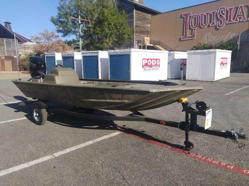 Slide: The Image of 2025 Tracker Grizzly 1648 SC boat on trailer in parking lot. - 6