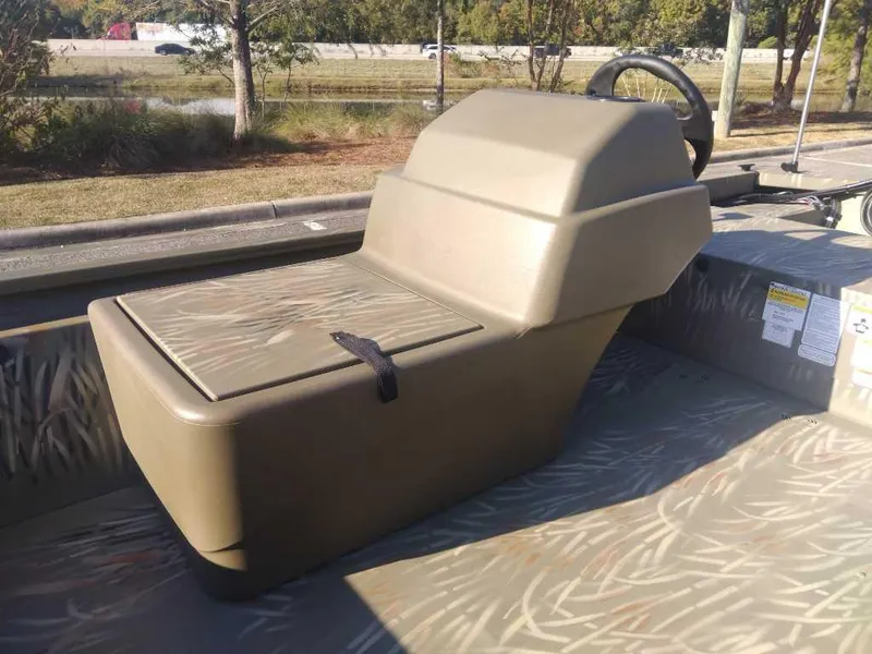 Slide: The Image of 2025 Tracker Grizzly 1648 SC boat seat and console in camouflage design. - 9