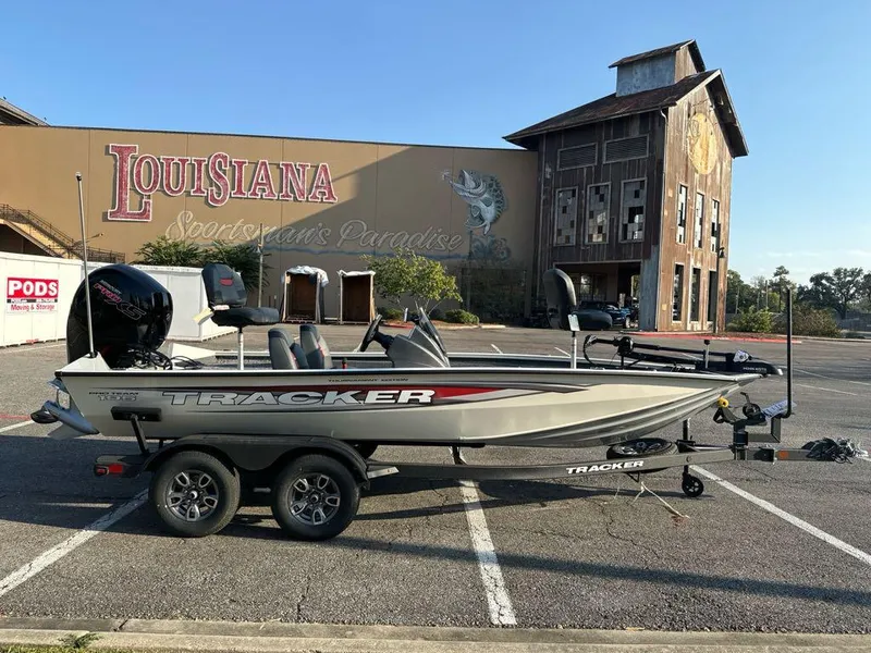 Slide: The Image of 2025 Tracker Pro Team 195 Tournament Edition boat parked outside Louisiana Sportsman's Paradise. - 2