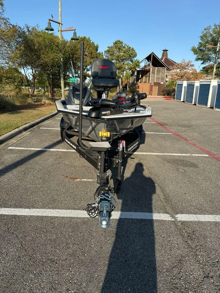 Slide: The Image of 2025 Tracker Pro Team 195 Tournament Edition boat in parking lot, front view. - 3
