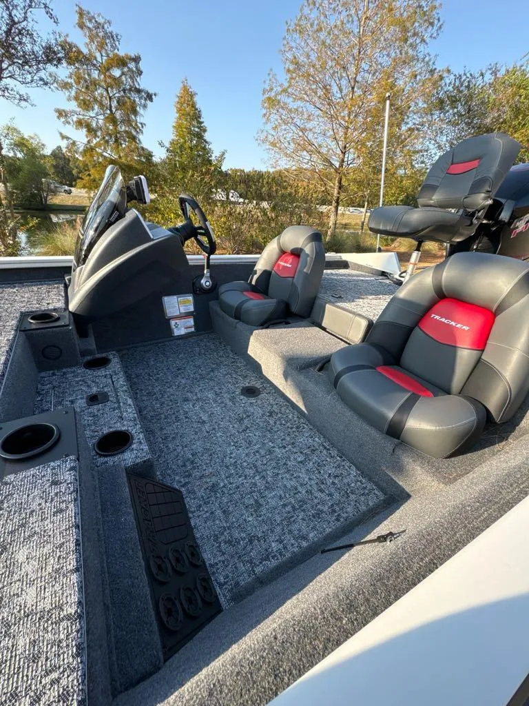 Slide: The Image of 2025 Tracker Pro Team 195 Tournament Edition boat interior with gray and red seating. - 5