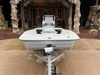 Slide: The Image of 2025 Mako Pro Skiff 17 CC boat on trailer, parked outdoors. - 47