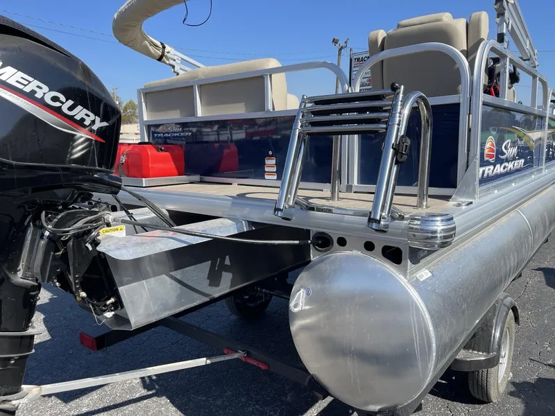 Slide: The Image of 2025 Sun Tracker Bass Buggy 16 XL Select pontoon boat with Mercury engine. - 3