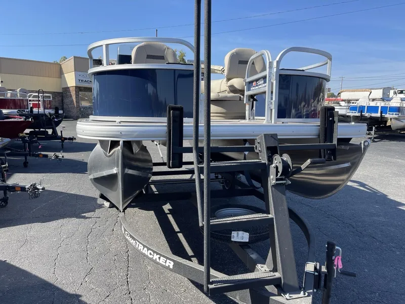 Slide: The Image of 2025 Sun Tracker Bass Buggy 16 XL Select pontoon boat on trailer. - 4