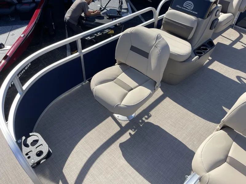 Slide: The Image of 2025 Sun Tracker Bass Buggy 16 XL Select pontoon boat interior with beige seating. - 6