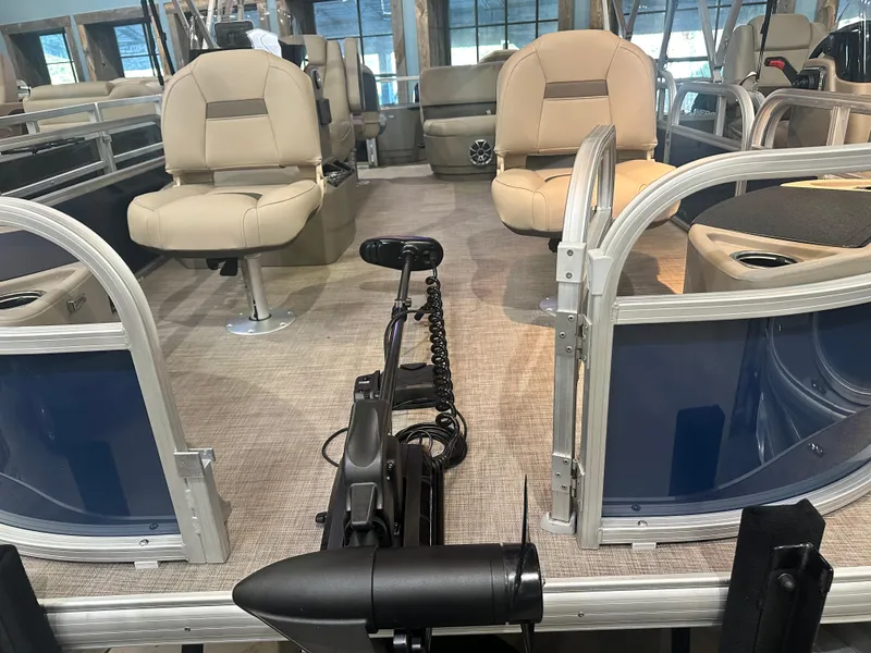 Slide: The Image of 2025 Sun Tracker Bass Buggy 18 DLX interior with seating and trolling motor. - 5