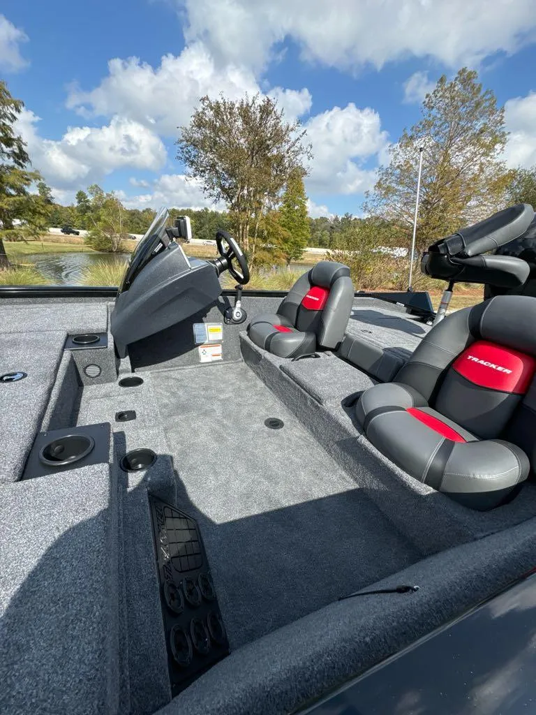 Slide: The Image of 2025 Tracker Pro Team 195 Tournament Edition boat interior with gray and red seating. - 5