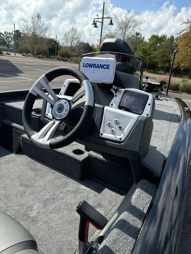 Slide: The Image of 2025 Tracker Pro Team 195 Tournament Edition boat dashboard with Lowrance navigation system. - 7