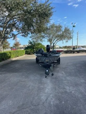 Slide: The Image of 2025 Tracker Pro Team 195 Tournament Edition boat parked outdoors. - 2