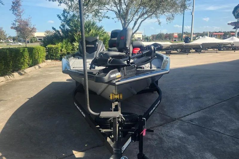 Slide: The Image of 2025 Tracker Pro Team 195 Tournament Edition boat on trailer, parked outdoors. - 3