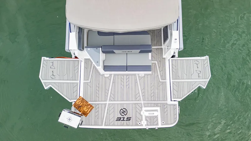 Slide: The Image of NHD 315 Open Deck 2025 boat, aerial view, spacious seating, elegant design. - 11