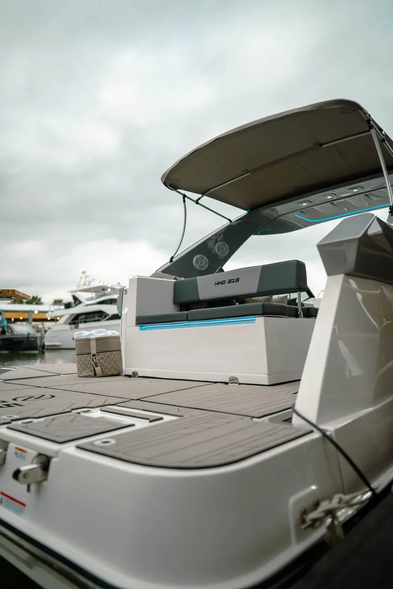 Slide: The Image of 2025 NHD 315 Open Deck boat with sleek design and spacious layout. - 13