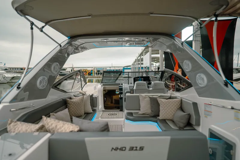 Slide: The Image of 2025 NHD 315 Open Deck boat with modern seating and sleek design. - 17