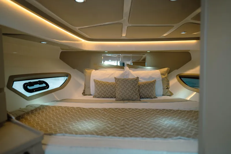 Slide: The Image of Luxurious cabin interior of 2025 NHD 315 Open Deck yacht, featuring elegant bedding and ambient lighting. - 22