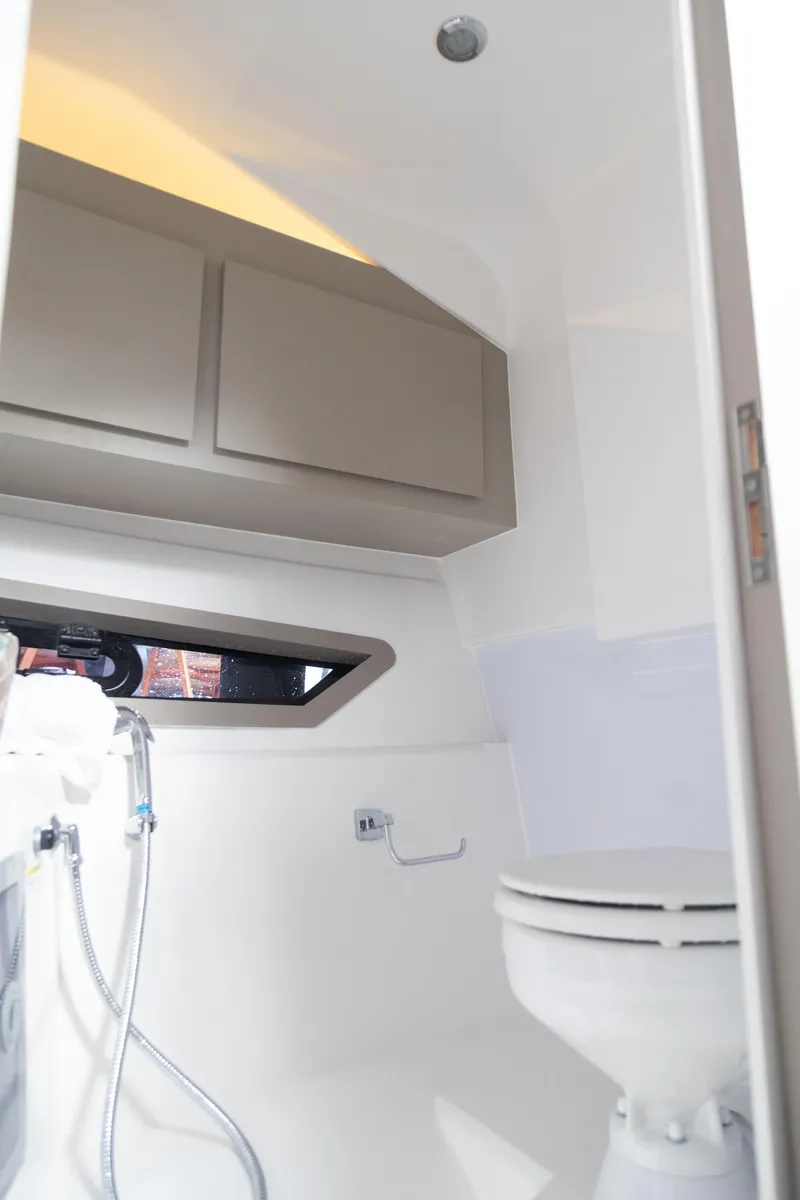 Slide: The Image of 2025 NHD 315 Open Deck boat bathroom interior with modern fixtures. - 25