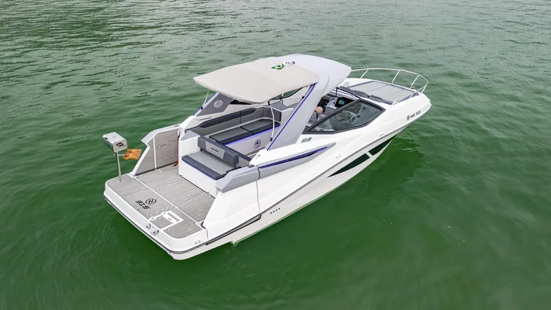 Slide: The Image of 2025 NHD 315 Open Deck boat on calm green water. - 3