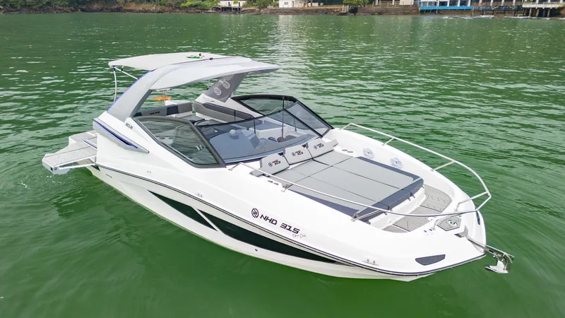 Slide: The Image of 2025 NHD 315 Open Deck boat on calm green water. - 8