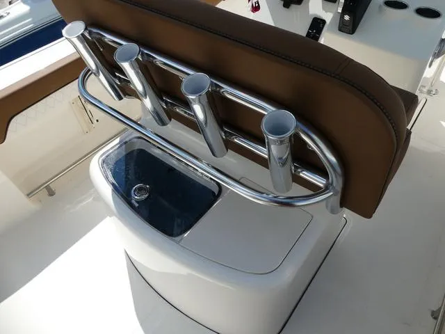 Slide: The Image of 2025 Pioneer Sportfish 202 boat console with steering wheel and controls. - 10