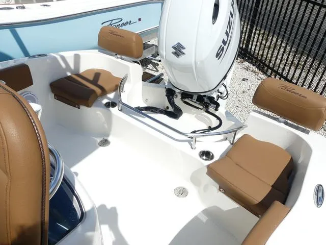Slide: The Image of 2025 Pioneer Sportfish 202 boat interior with brown and white cushioned seating. - 15