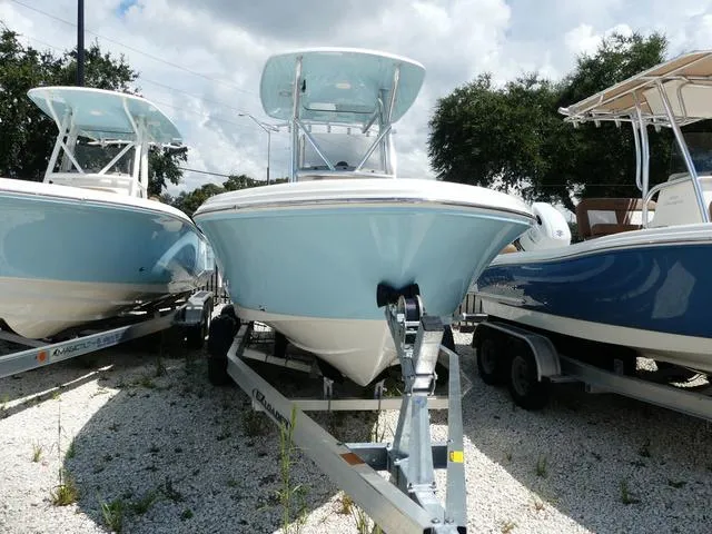 Slide: The Image of 2025 Pioneer Sportfish 202 boat on trailer, displayed outdoors. - 3