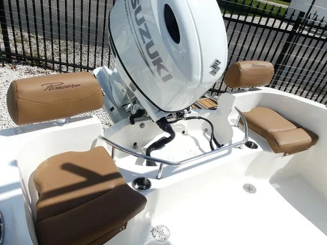Slide: The Image of Pioneer Sportfish 2025 boat seat with rod holders and storage compartment. - 9
