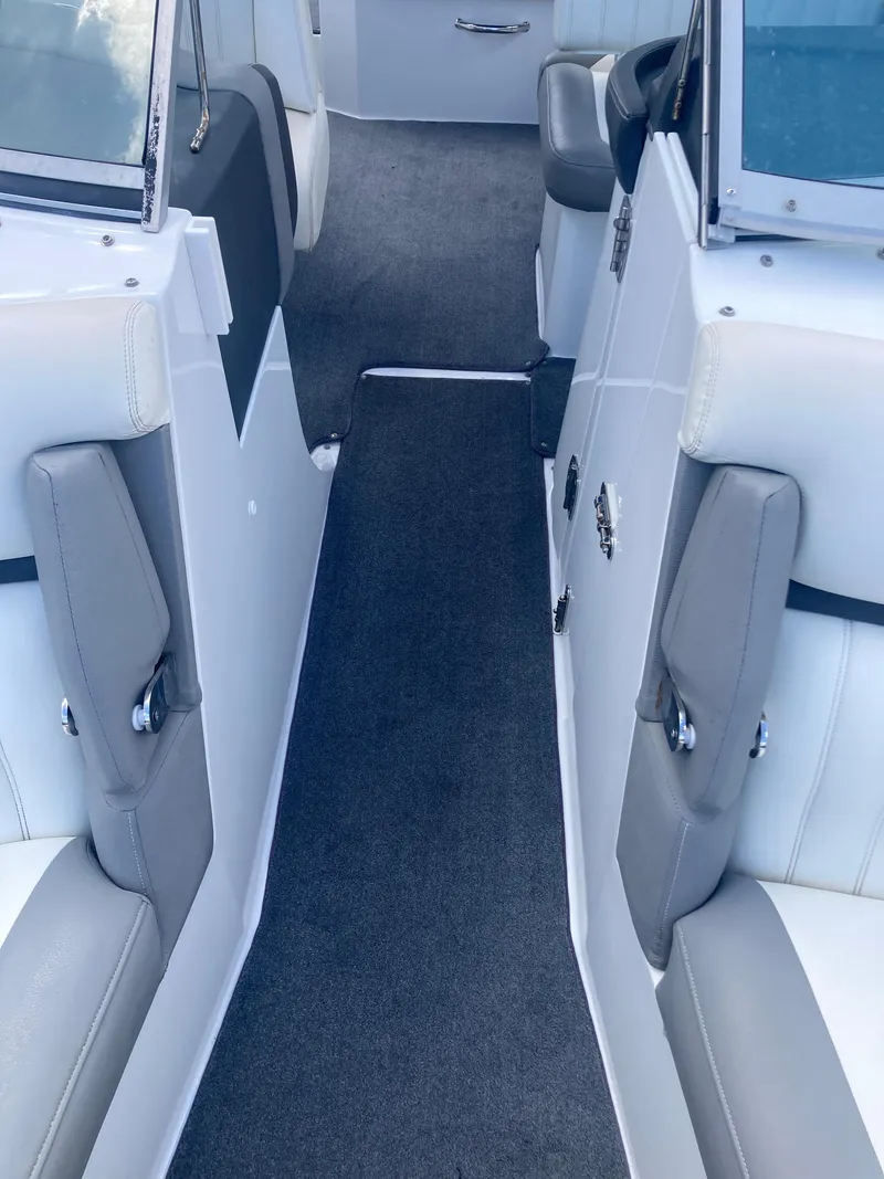 Slide: The Image of Interior view of 2013 Cobalt 24SD boat with gray and white seating. - 13