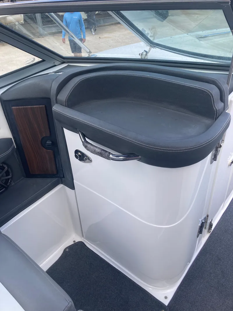 Slide: The Image of 2013 Cobalt 24SD boat interior with sleek seating and modern design. - 15