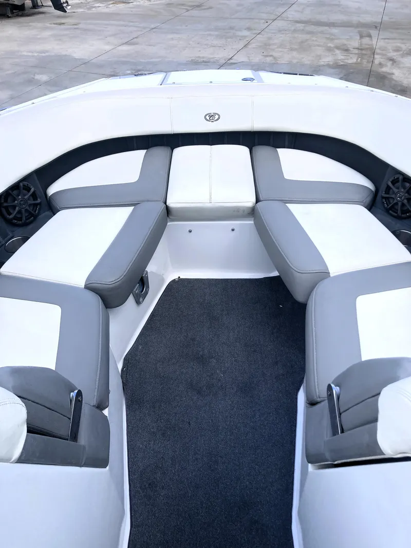 Slide: The Image of 2013 Cobalt 24SD boat interior with gray and white seating. - 9