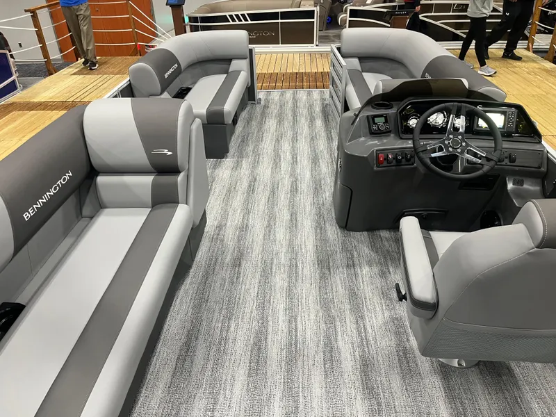 Slide: The Image of 2025 Bennington S Line boat interior with gray seating and modern dashboard. - 5