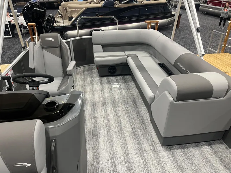 Slide: The Image of 2025 Bennington S Line pontoon boat interior with gray seating and modern design. - 6